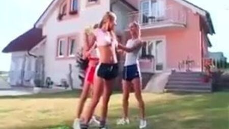 Girls in Adidas shine shorts and sports shoes