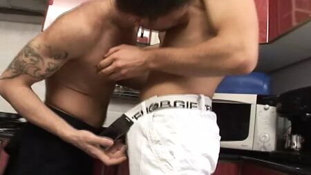 Two friends get involved in gay sex games and have horny and crazy sex in the kitchen