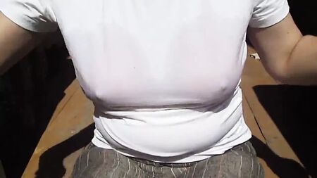 Girl removes wet swim-bra under her wet t-shirt