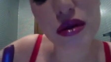 Sexy woman putting on lipstick