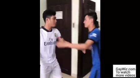 Two Asians wearing soccer uniform have sex