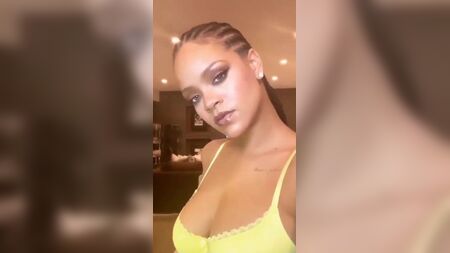Rihanna selfie showing her big cleavage in a bra