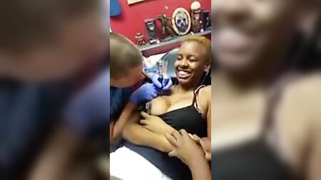 Nipple Pops Out While Getting Tatted