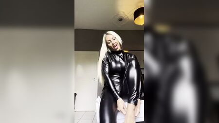 Mascular bodybuilder girl in latex