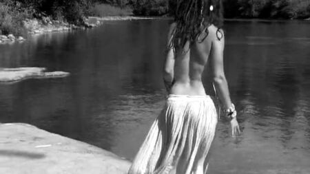 Hippie girl in flowing skirt dancing