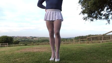 Outdoor public white stockings and suspenders .