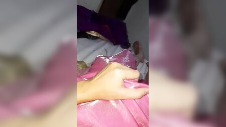 Crossdresser wearing long satin prom pink dress