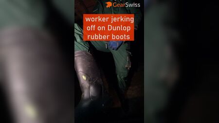 worker jerking of on Dunlop rubber boots